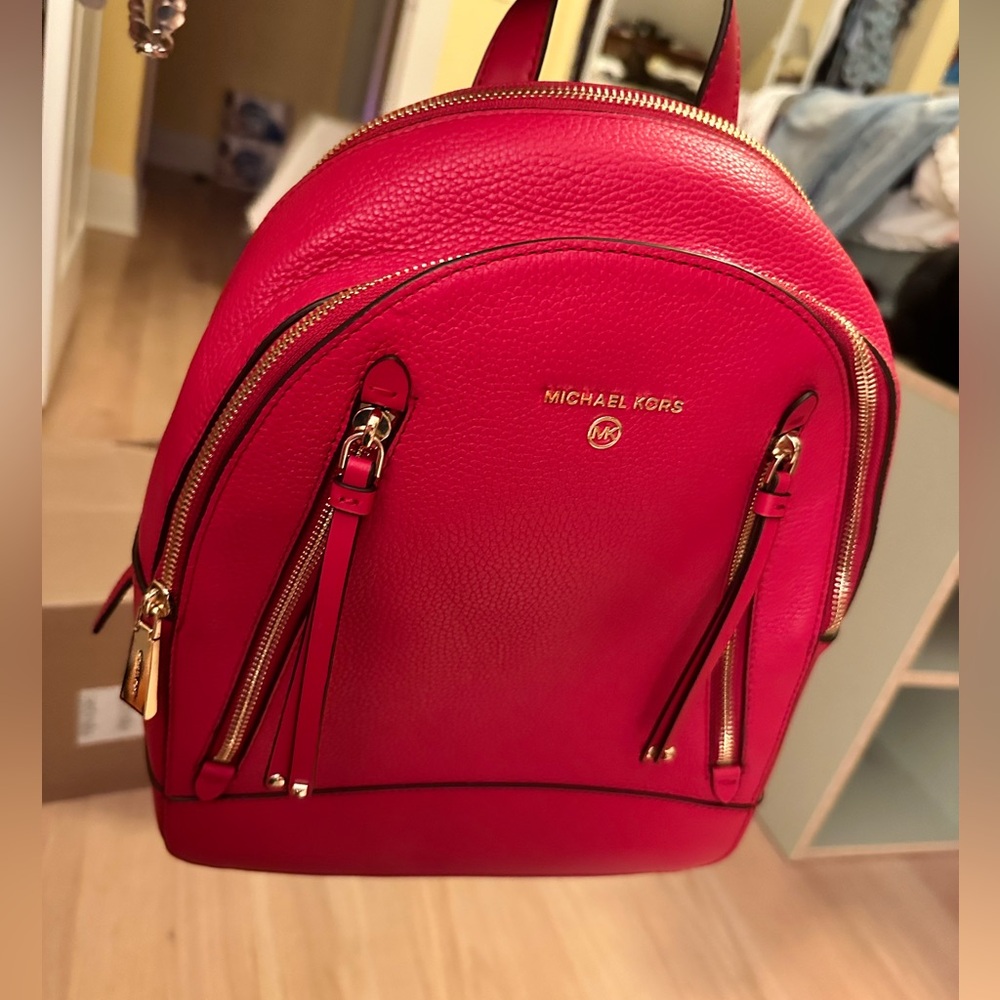 Michael Kors Red Pebbled Leather backpack purse.